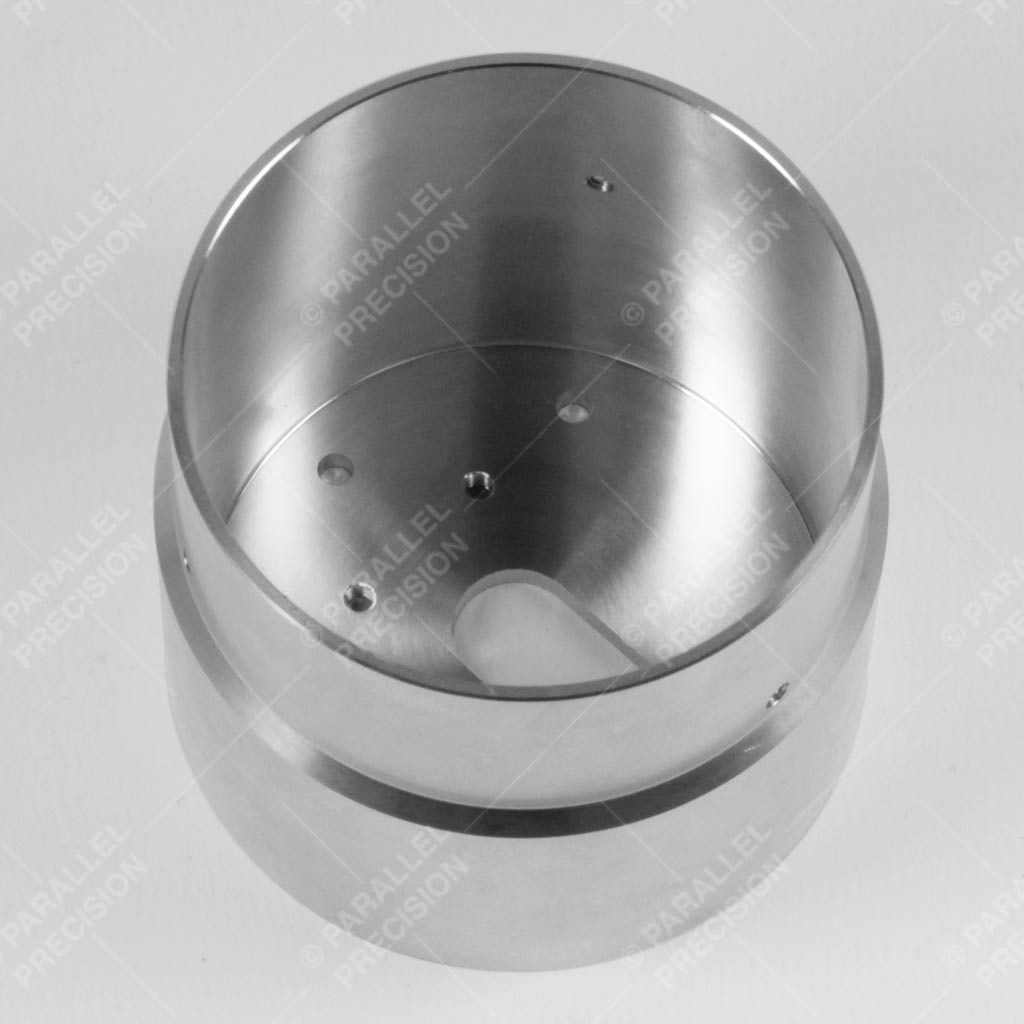 cnc turned aluminium part with large bore, hollowed out thin walls and live tooling for drilling and tapping the diameter